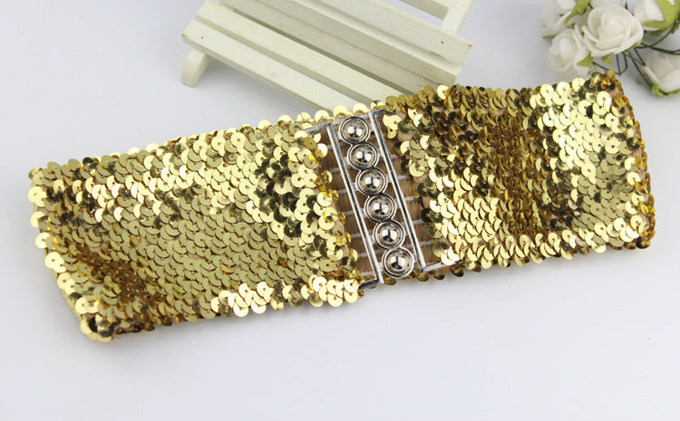 woman modeling sequin belt with dark dress