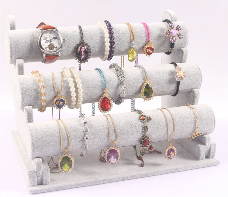 Stylish triple-layer display stand showcasing accessories