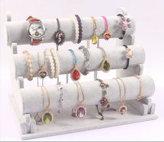 Stylish triple-layer display stand showcasing accessories