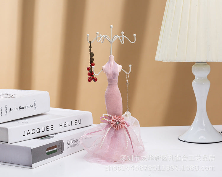 Human-shaped jewelry stand with multiple ornaments