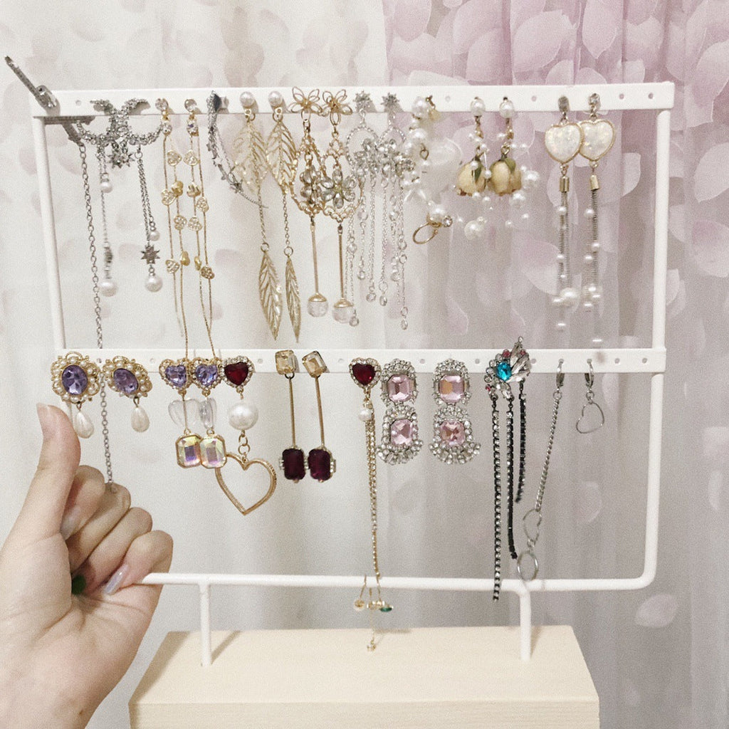 Close-up of Metal Earring Holder with Wooden Base - Image 2