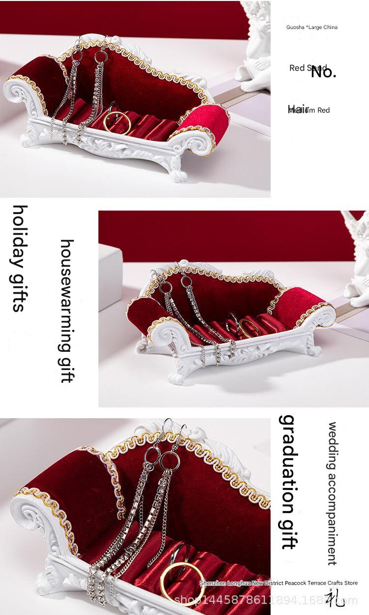 Sofa-shaped jewelry organiser showcasing elegant design