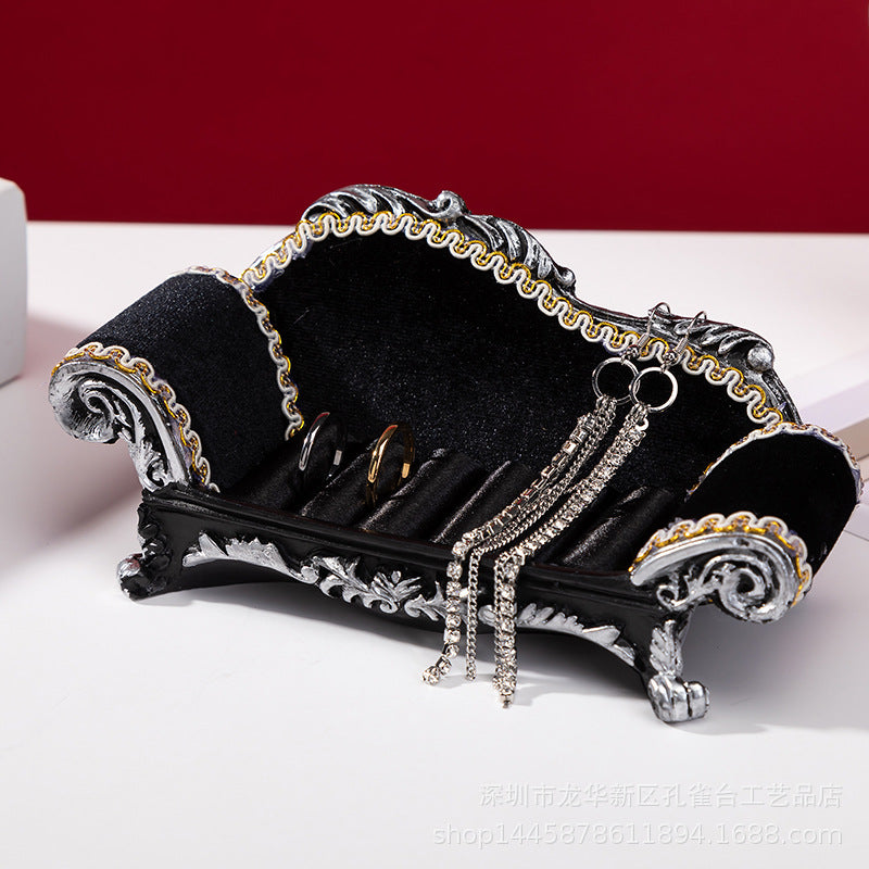 Sofa-shaped jewelry organiser showcasing elegant design