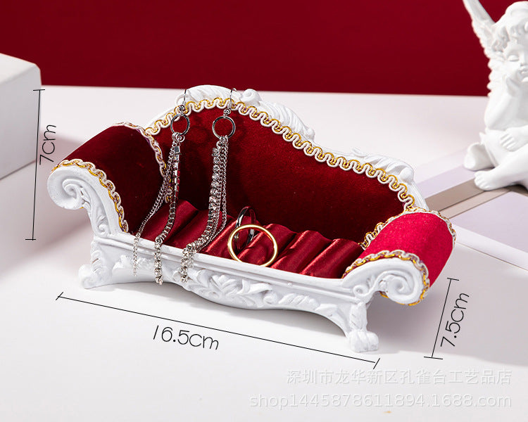Functional compartments in jewellery storage sofa