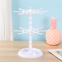 white rotating accessory stand in action