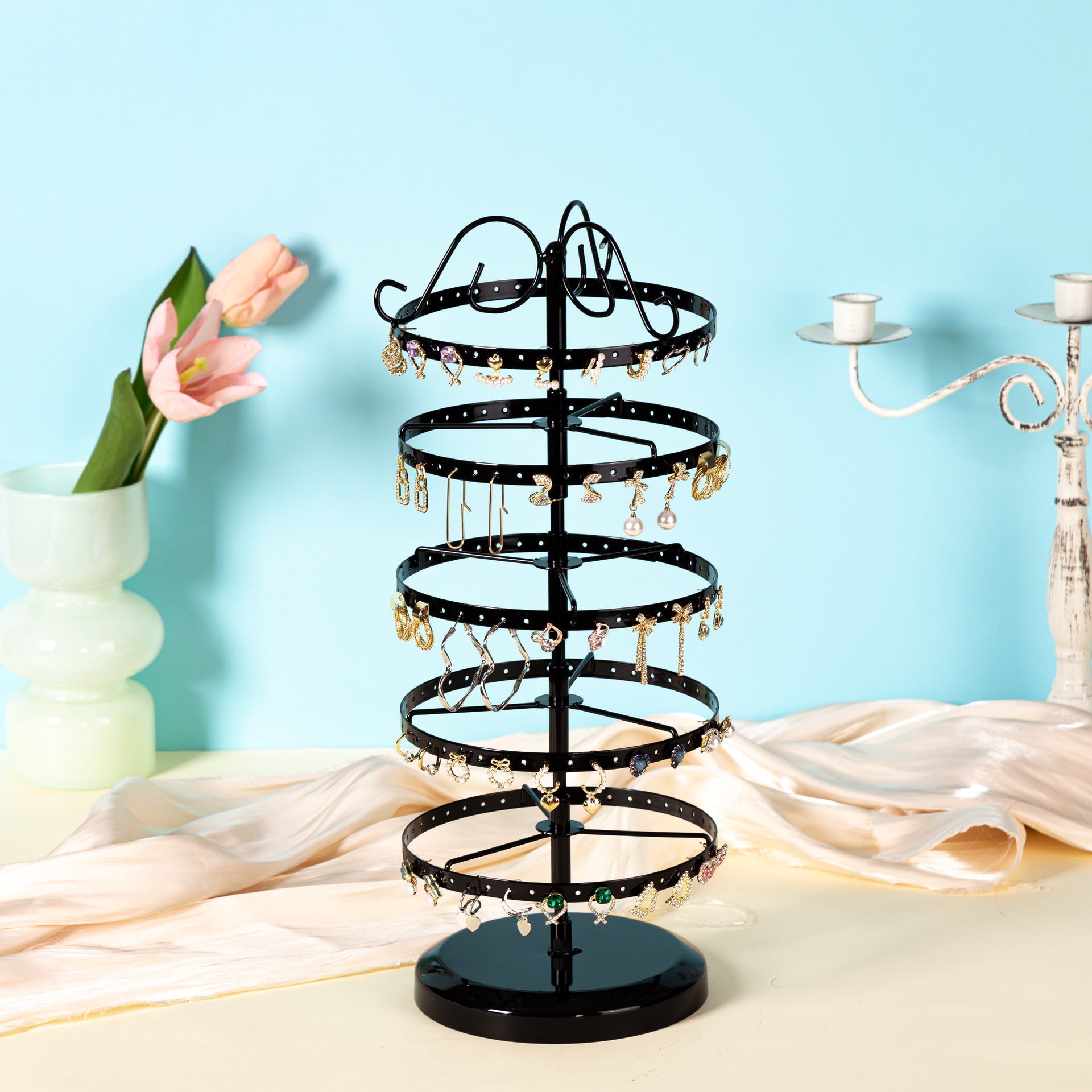 Functional rotating display of earrings in black and white