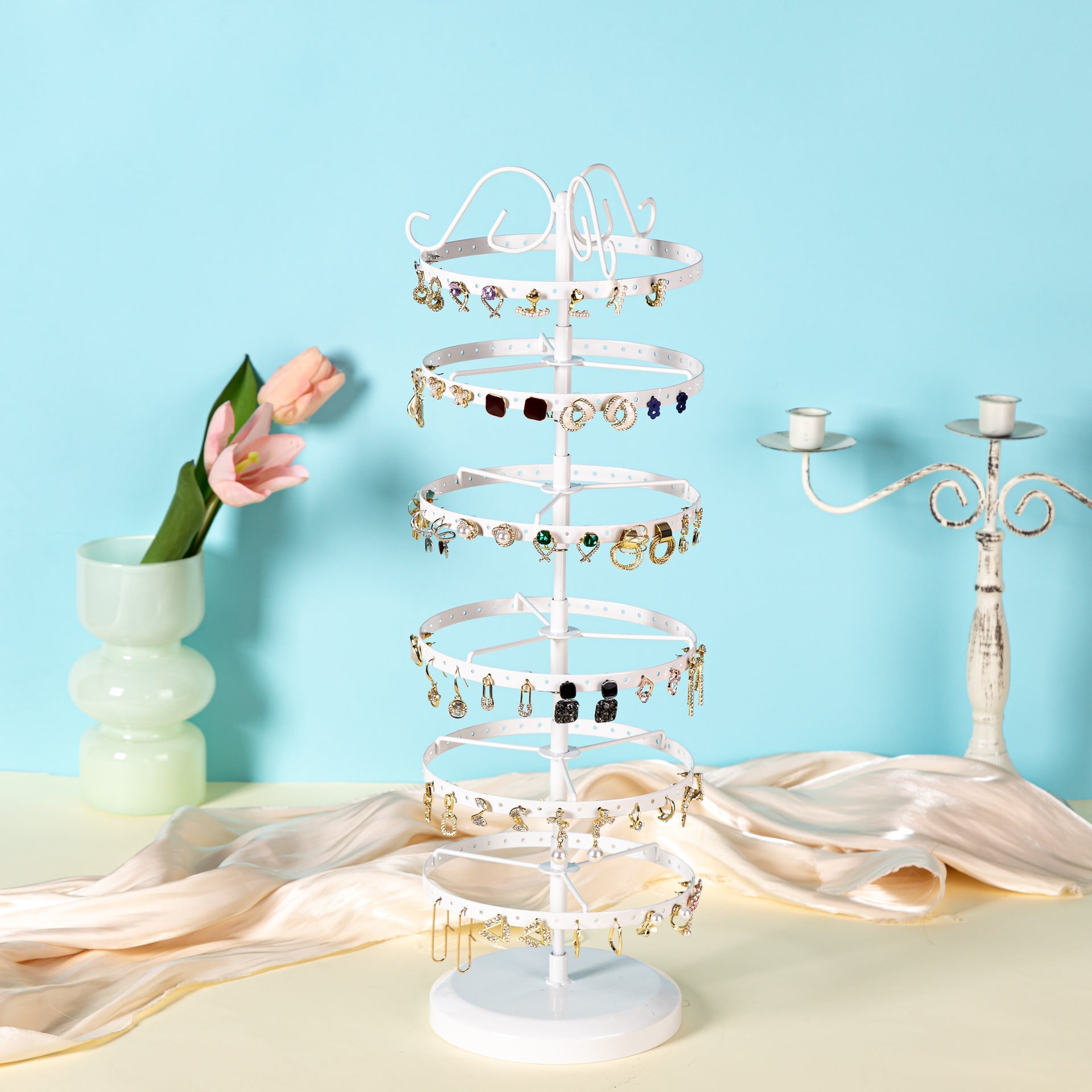 Top view of metal earring display stand with earrings