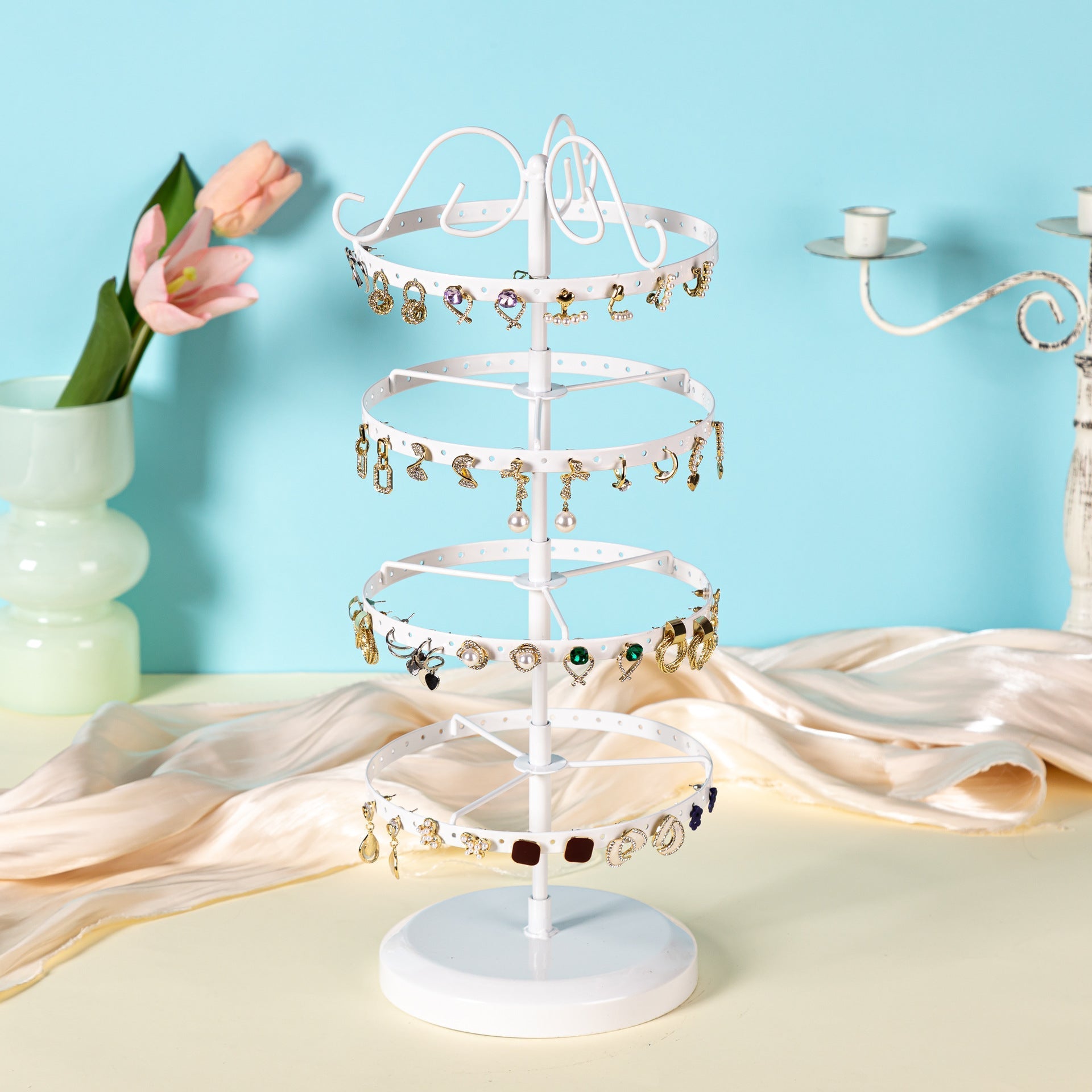 Versatile metal earring stand showing multiple earrings