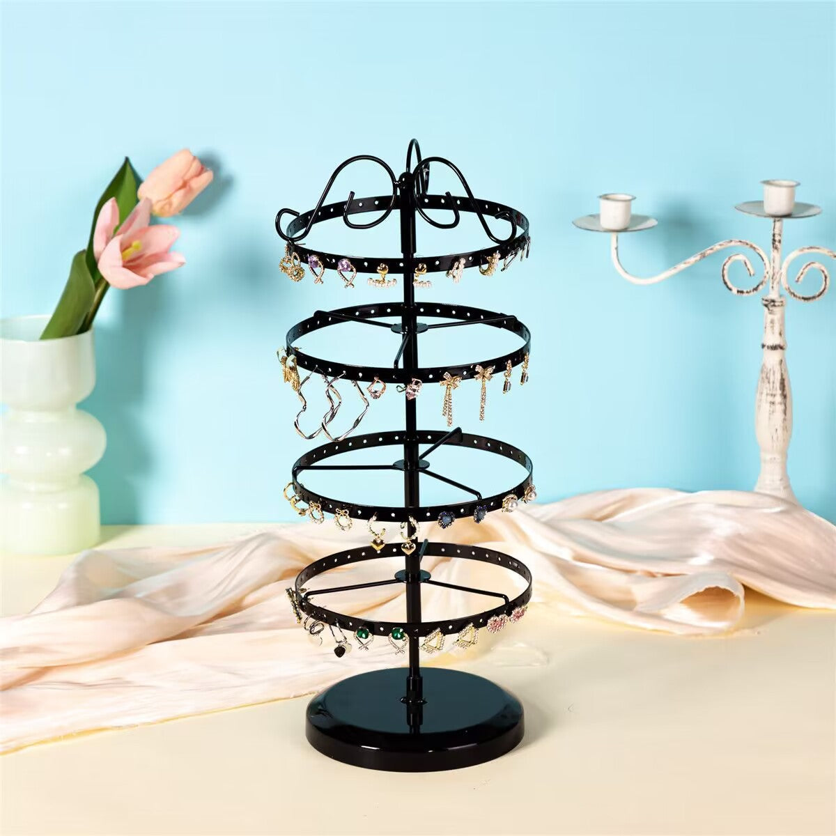 Elegant black metal jewellery holder with accessories