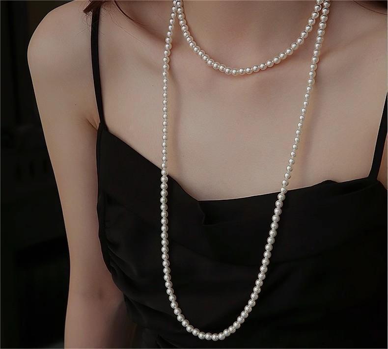 pearl necklace showcased on jewellery stand