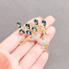 Various angles of the blue crystal deer brooch