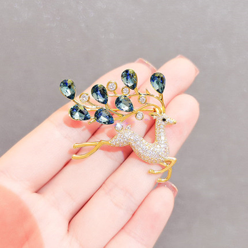 Various angles of the blue crystal deer brooch