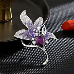 Purple lily brooch on a stylish jacket