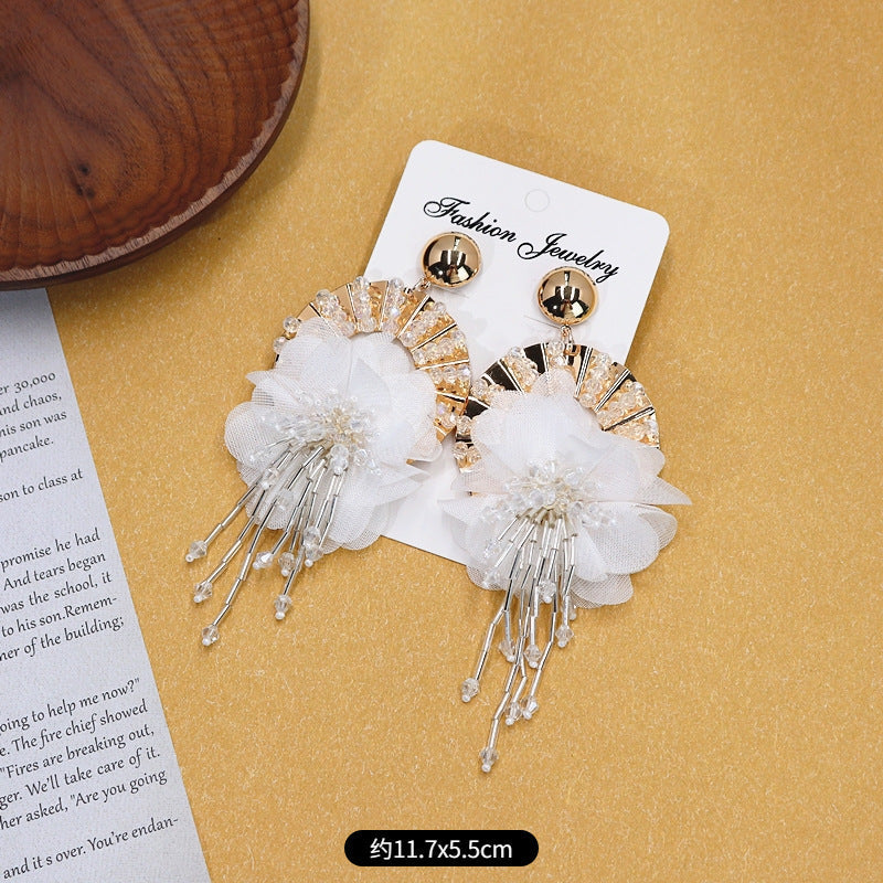 Earrings styled with vibrant summer fashion