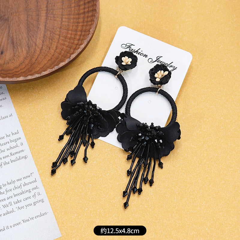 Close-up of intricate design detail on tassel earrings