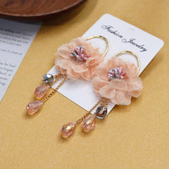 Earrings styled with vibrant summer fashion