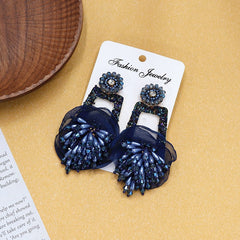 Earrings styled with vibrant summer fashion