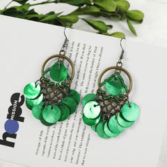 Colorful long tassel earrings displayed on a model