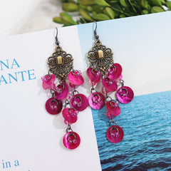 Display of multiple mother-of-pearl earrings