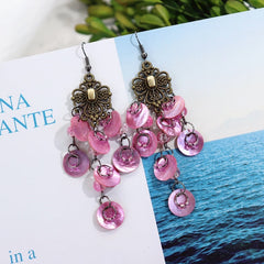 Close up of vintage mother-of-pearl earrings
