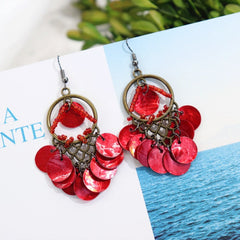 Colorful long tassel earrings displayed on a model