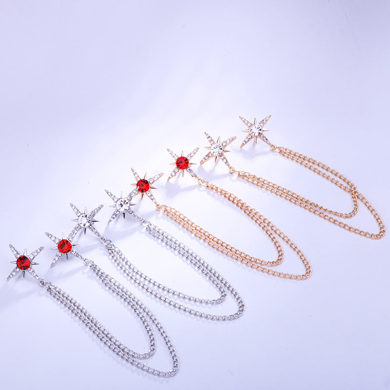 Stylish star-shaped brooch design with red and white crystals