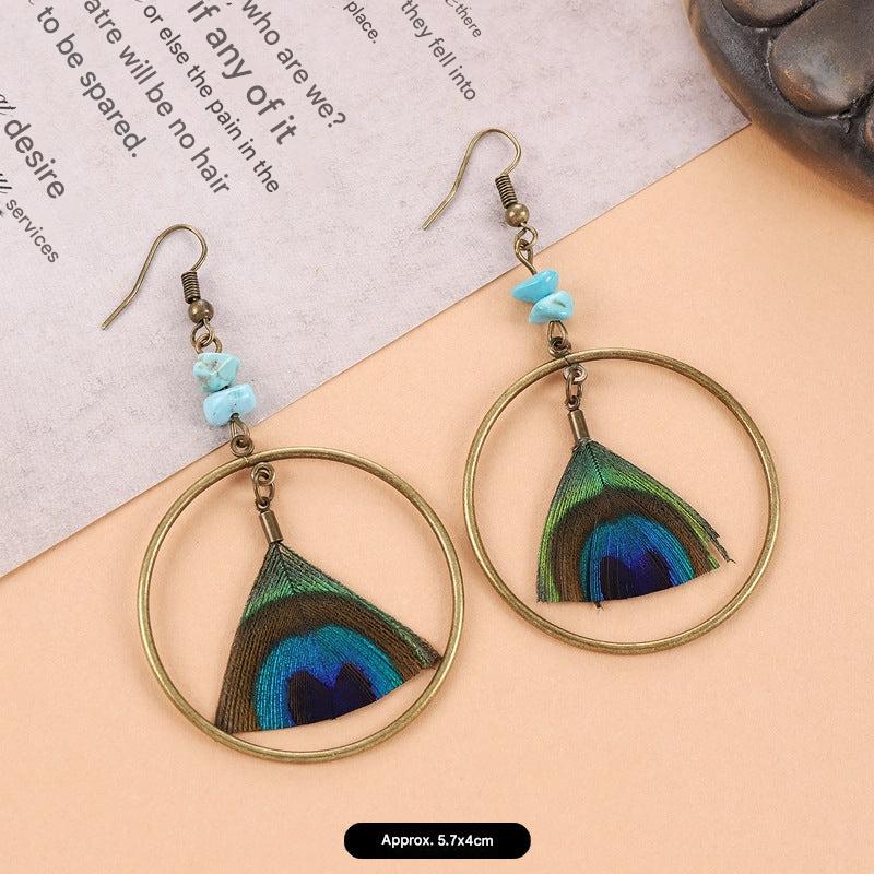 Artistic feather earrings on display image 8