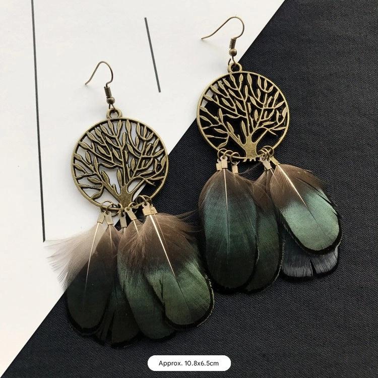 Artistic feather earrings on display image 8