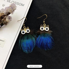 Detailed view of owl and peacock earrings image 10