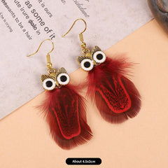 Close-up of colourful feather earrings image 2