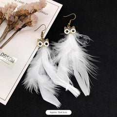 Detailed view of owl and peacock earrings image 10
