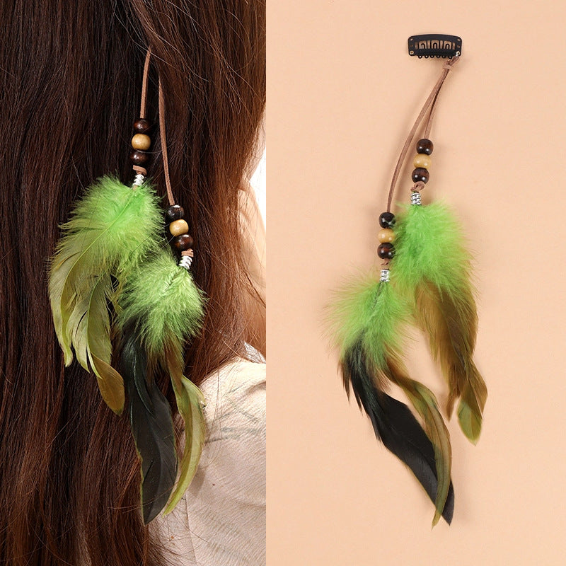 Handmade feather hair accessory with chic tassels