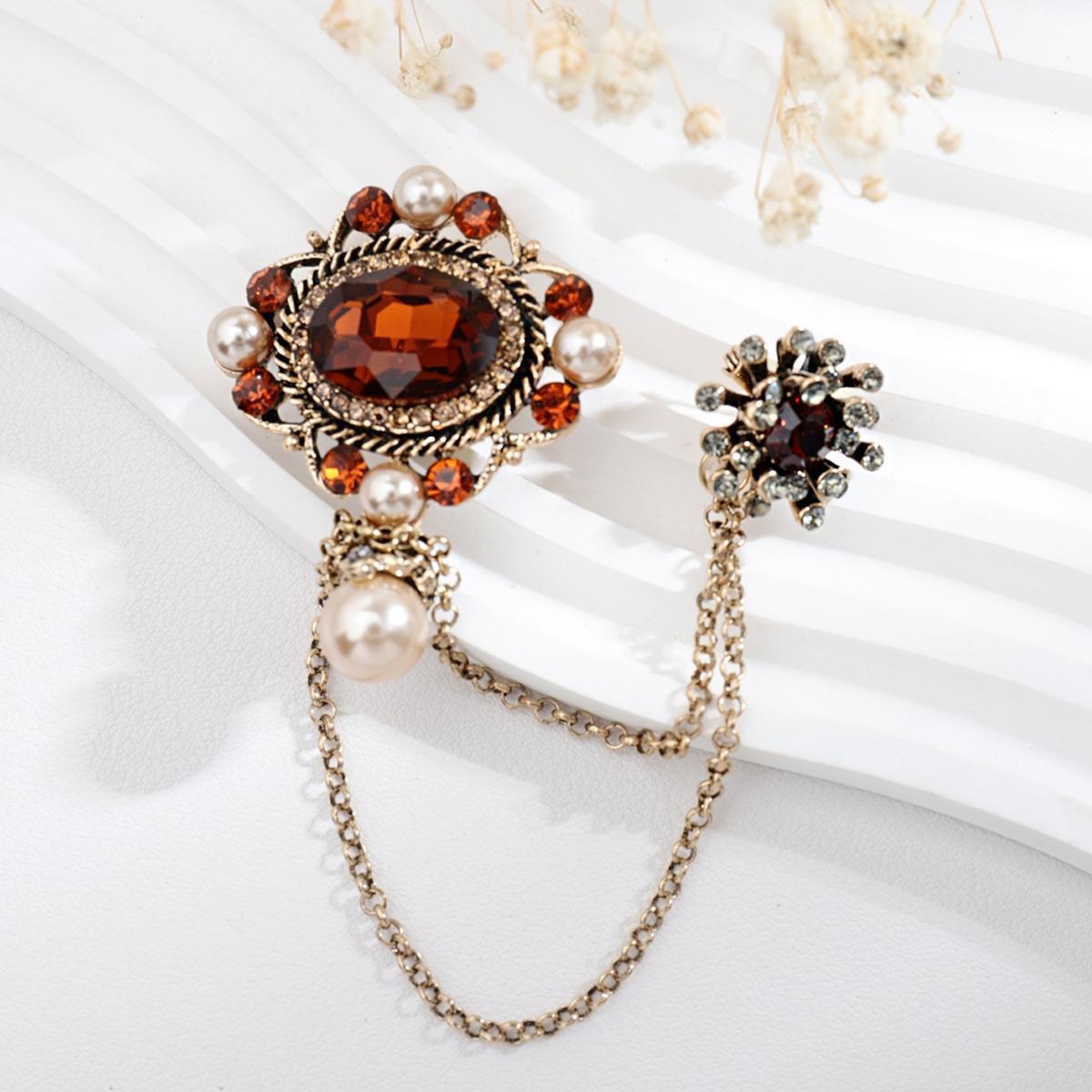 Necklace and brooch set on elegant display