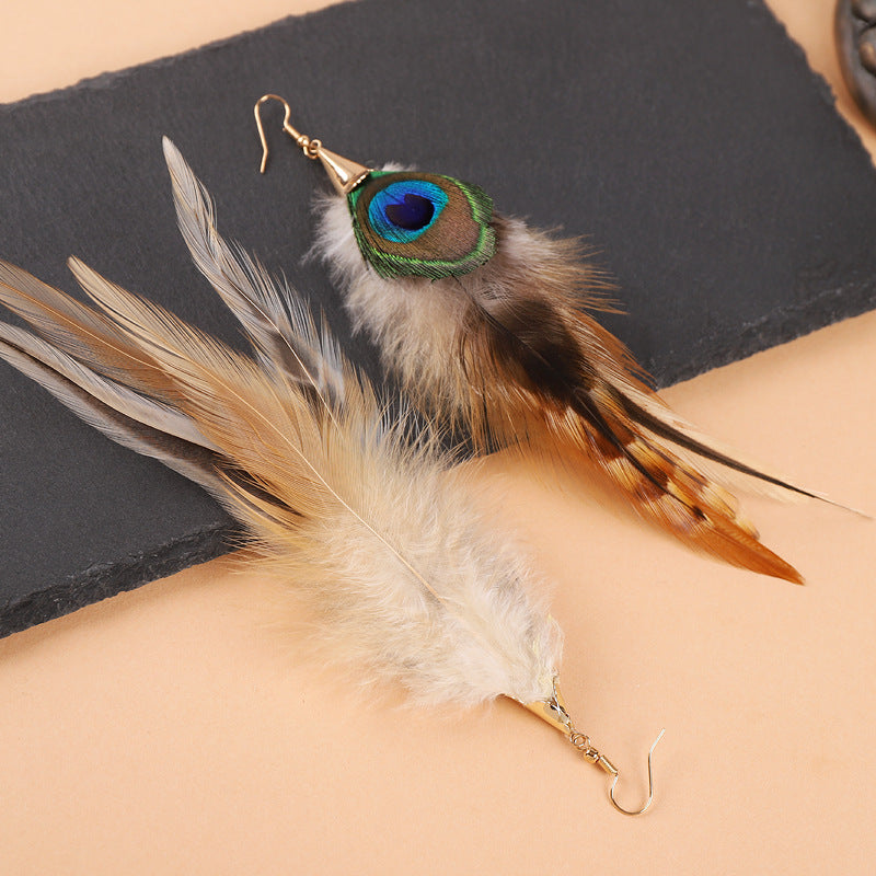 Feather earrings on a stylish background