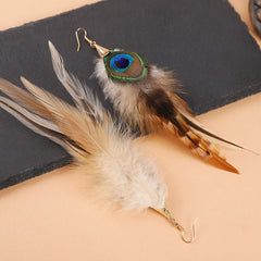 Feather earrings on a stylish background
