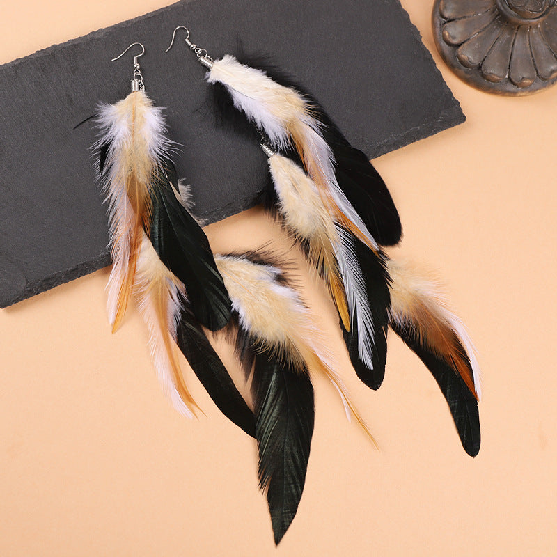 Variety of feather earrings in different colours