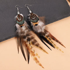 Fashion model wearing feather earrings
