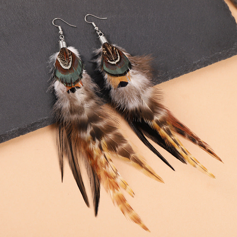 Fashion model wearing feather earrings
