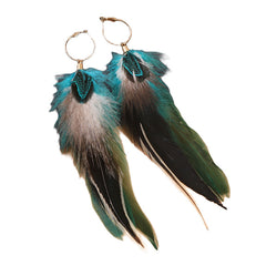 Feather earrings on a stylish background