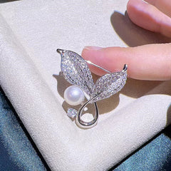 Elegant brooch placed alongside formal attire