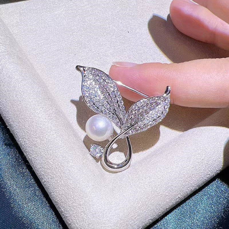 Elegant brooch placed alongside formal attire