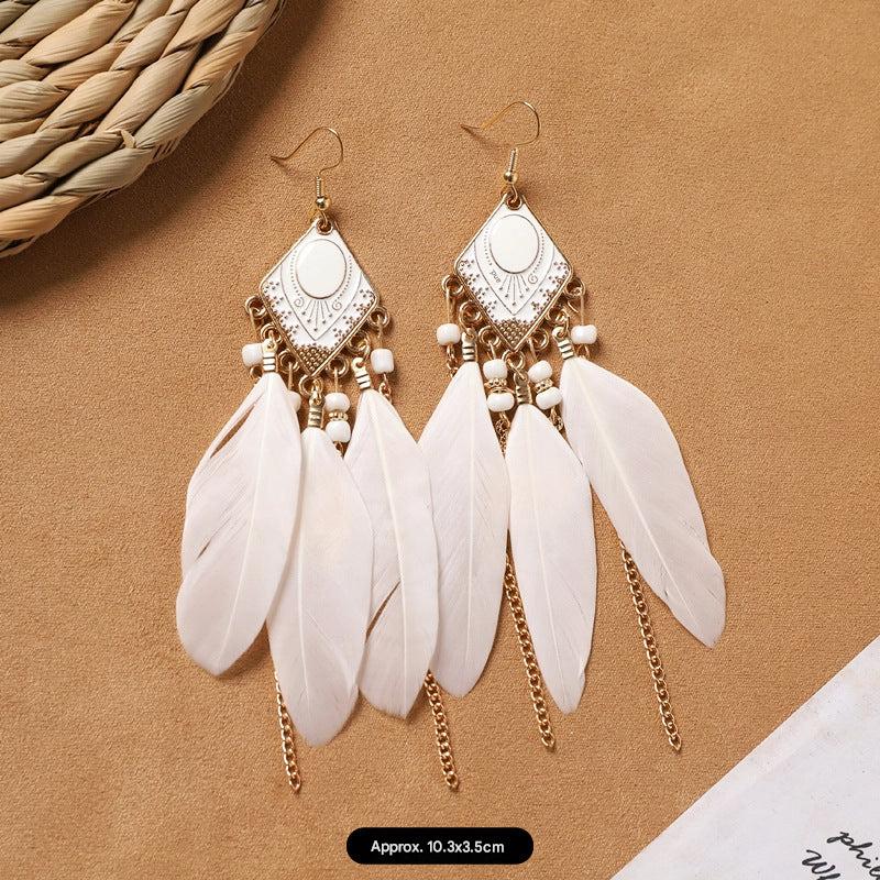 model wearing vintage style feather earrings