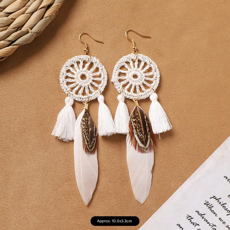 feather earrings in pastel hues
