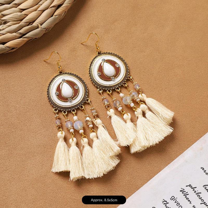 feather earrings displayed on a white background