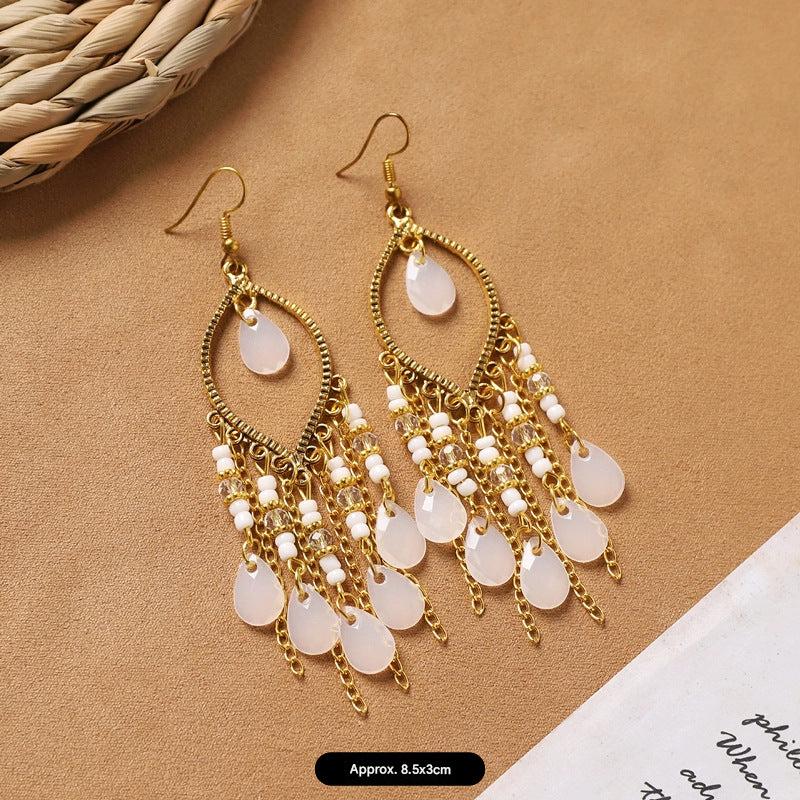 handcrafted feather earrings with long tassels