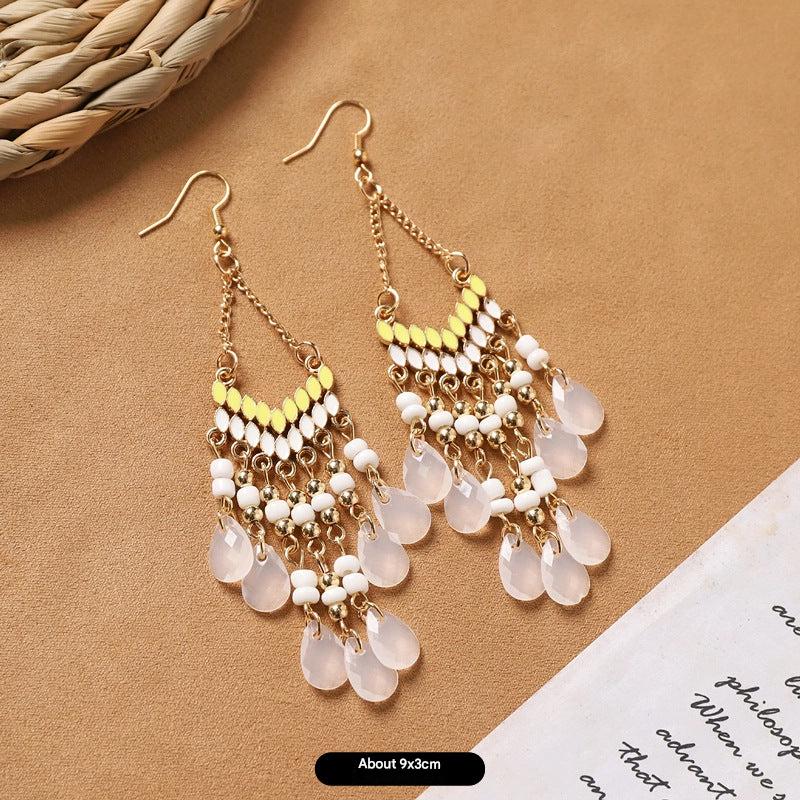 feather earrings in pastel hues