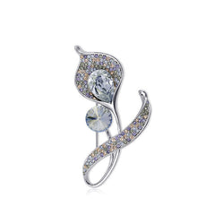 Affordable chic brooch placed on a dark surface