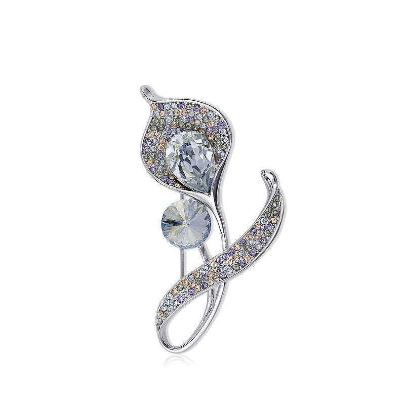 Affordable chic brooch placed on a dark surface