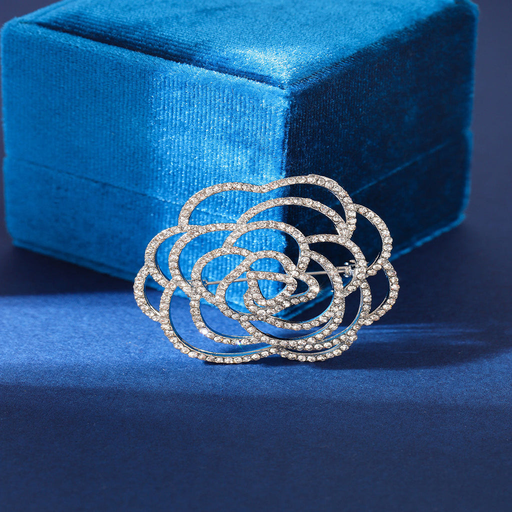 floral design brooch styled on fabric