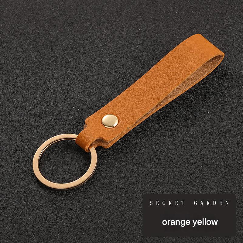 Minimalist keyring holder displayed with accessories